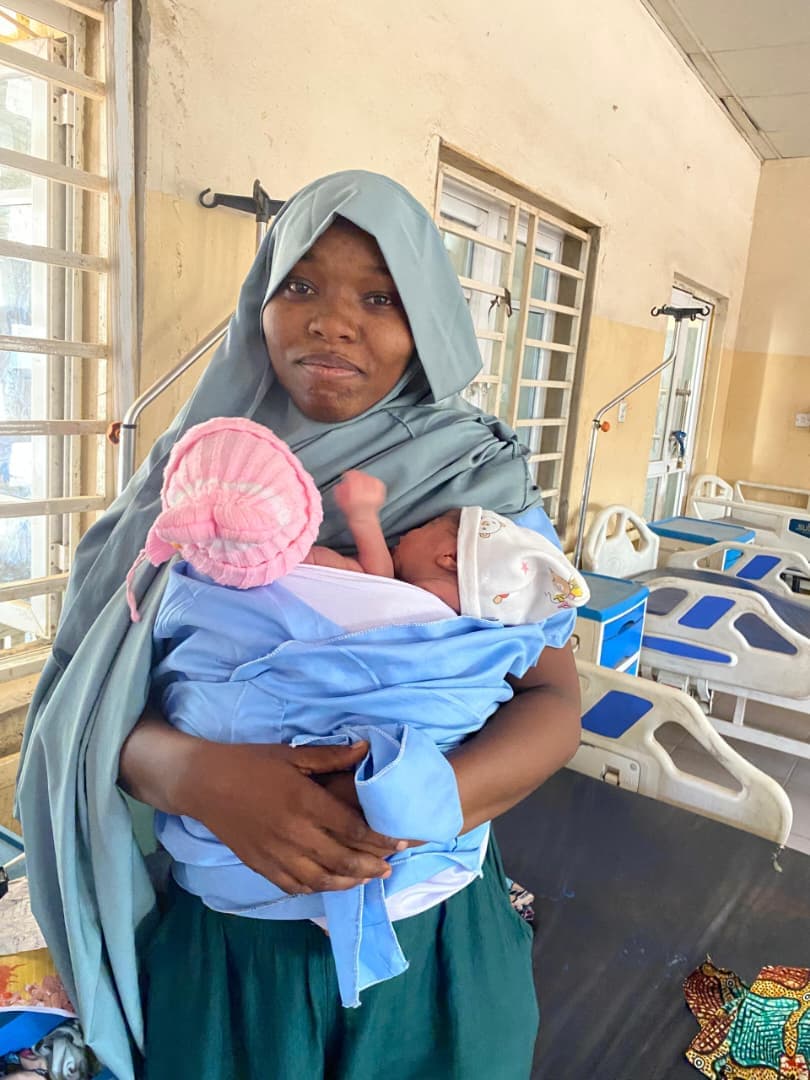 A mother holding her newborn in Kangaroo Care